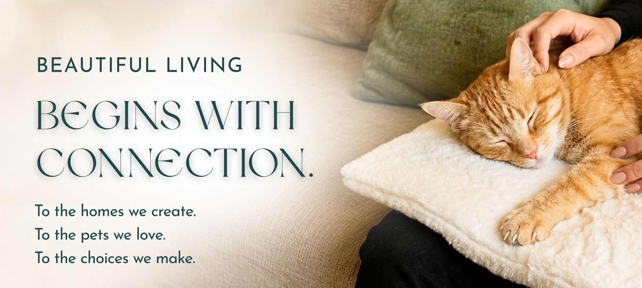 An orange tabby cat rests on a Knead-it Pad with its claws out while being gently pet by a woman whose lap is protected from the cat's claws with the Knead-it Pad on her lap; there is large text on the left reading 'BEAUTIFUL LIVING BEGINS WITH CONNECTION.' and continued with "to the homes we create, to the pets we love, to the choices we make."