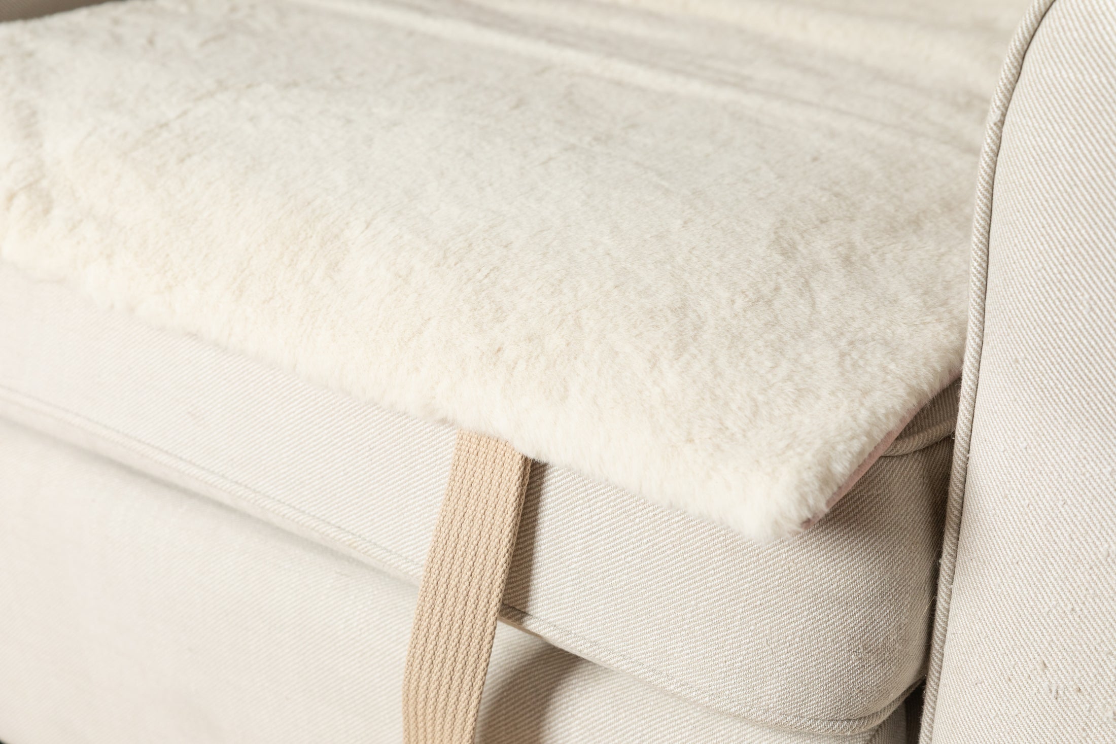 A close up photo showing the high quality, plush, faux fur detail of the portable lounge mat from Fluff & Boots
